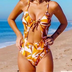 Abstract cut out one piece bathing suit